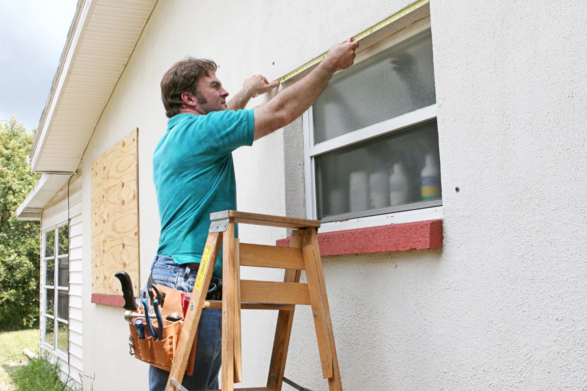 An image of a person working on Hurricane Shutter Repair in Fort Pierce, FL
